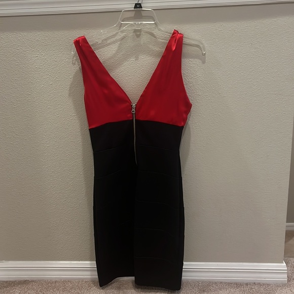 A black and red v-neck tighter fitted dress. It is pretty fancy. - Picture 2 of 3